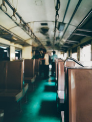 Fototapeta premium Out of focus of People are stepping out a train that just arrived on a railway platform