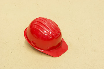 Fototapeta premium Red protective helmet lying on the floor.