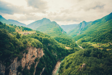 The Tara River and Canyon, and its countryside, in northern Montenegro. Montenegro,Tara River next to Djurdjevi bridge - obrazy, fototapety, plakaty