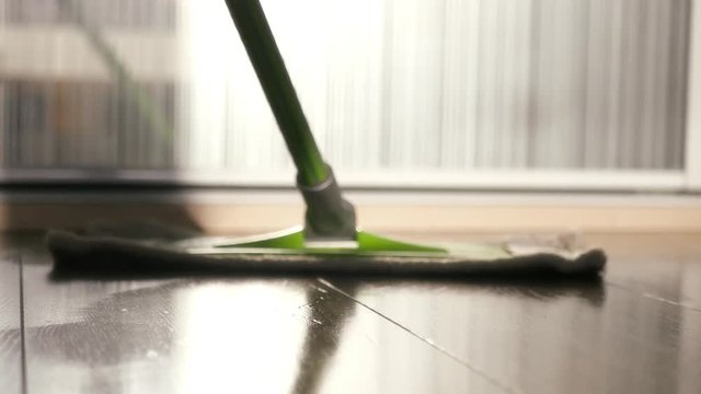 Clean the room, wash the floor with a green mop. 4k, 3840x2160. HD