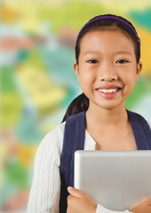 Girl with tablet against blurry map