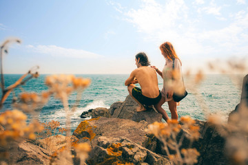 Loving couple looking at the sunset on the sea shore. Black Sea Coast