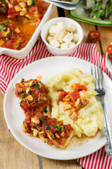 Fish cod baked in tomato sauce with feta cheese