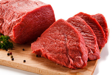 Fresh raw beef steaks on white background