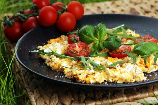 Traditional breakfast - fried eggs,ruccola, tommato- - diet concept scrambled eggs