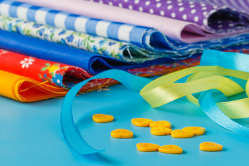 ribbon and scissors on blue background