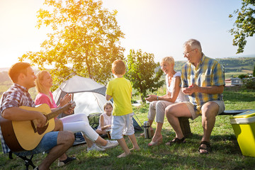 happy family and children enjoying with guitar.