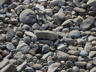 Fototapeta na wymiar Small stones near a lake