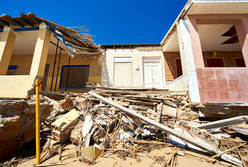 Damaged beach houses. Spain