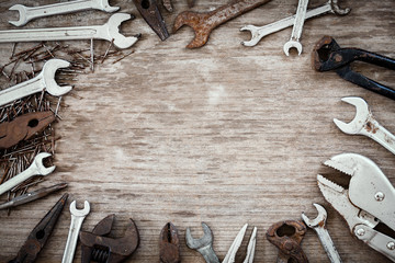 Set of mechanic tool with empty space on a wooden, made for text or brand.