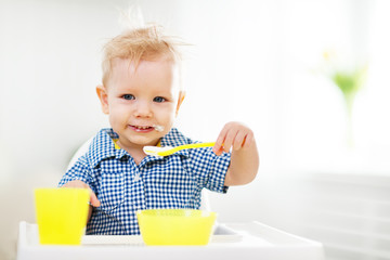 Happy baby eating himself.