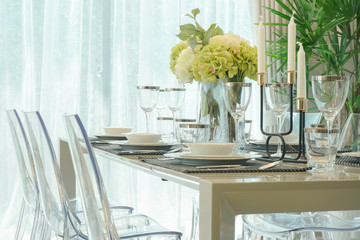 Dining table with vase of flower in dining room