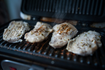 Chicken breast cooked on the grill, grilled meat
