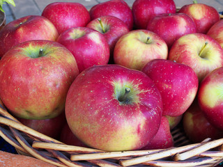Red apples in wooden basket