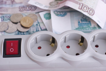 Outlet extension socket and russian ruble banknotes