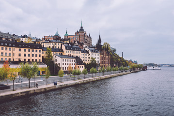 Autumn view of Old Town pier architecture in Sodermalm district in Stockholm, Sweden. Stockholm cityscape with Riddarfjarden marina and Soder Malarstrand embankment.