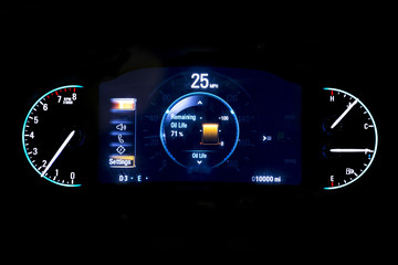 Modern light car mileage on black background 25 mph.