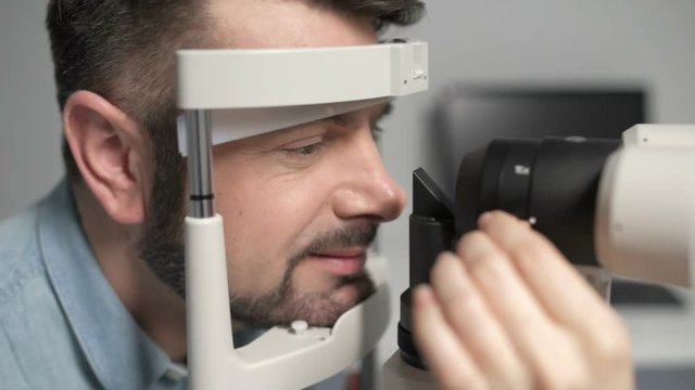 Scaled up of bearded man undergoing eye examination