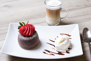 Chocolate fondant lava cake with strawberries and ice cream