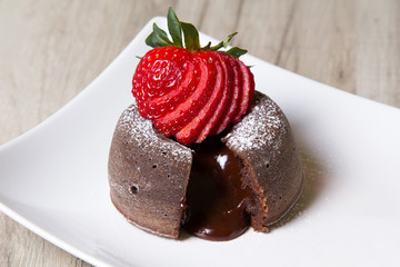 Chocolate fondant lava cake with strawberries