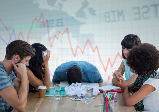 People bored at meeting against downward graph