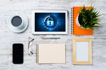 Web security and technology concept with tablet pc on wooden table