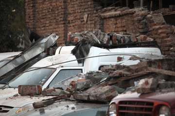 Rubble over cars during an earthquake in Chile.