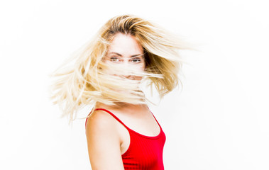 Portrait of Beautiful Blond Woman Shaking Her Hair