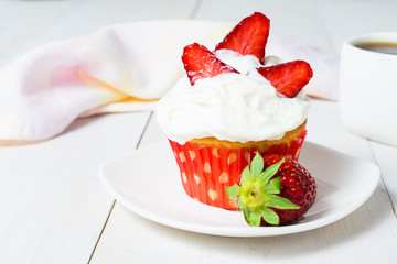Strawberry cupcake with whipped cream