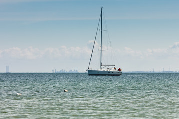 Yacht sail boat on calm sea water