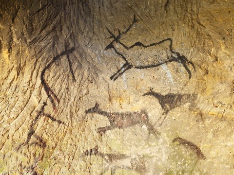 Discovery of prehistoric paint of caveman hunt in sandstone cave. Paint of human hunting
