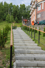 Modern staircase near apartment house on a hillside. Carpathians, Ukraine