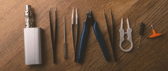 vape device or electronic cigarette with vaping tools and accessories.