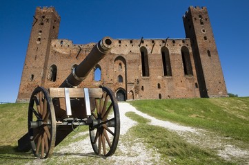 Cannon and ruins of conventual Gothic style castle of the Teutonic Knights' Commandry in Radzyn Chelminski, Poland