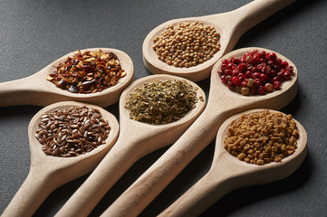 Various of spices in wooden spoons