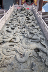 Lion statue and buddha state on chinese temple in Thailand