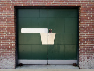 Green Industrial Door in Old Brick Building