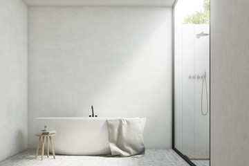 Fototapeta na wymiar White bathroom with a tub