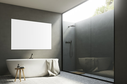 Gray bathroom with a tub and poster, corner
