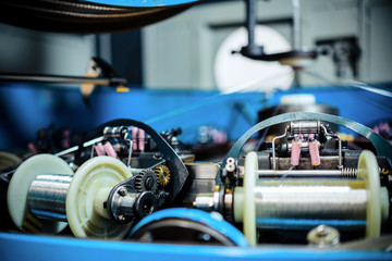Obraz premium The mechanism of a braiding machine close-up.