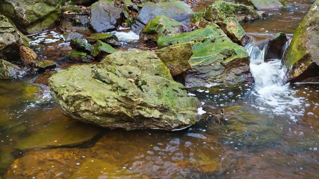 Detail shot of a small waterfall of the mountain creek Tro Maret in the Ardennes, Belgium.