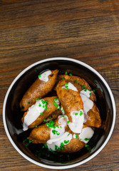 Fried Ravioli with Sauce on a wooden background. with copy space. top view