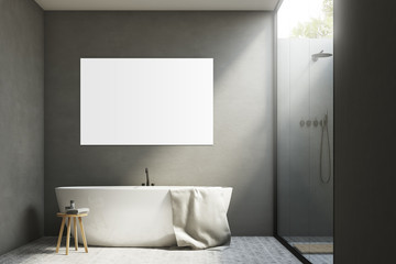 Gray bathroom with a tub and poster