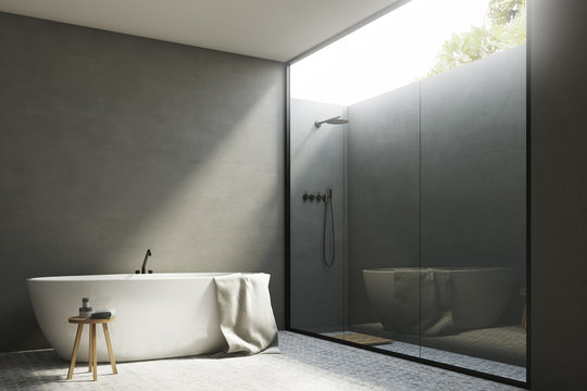 Gray bathroom with a tub, corner