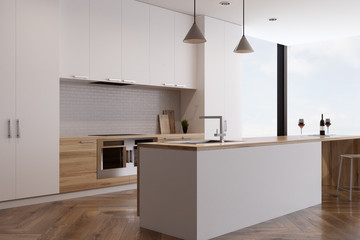 Kitchen with two ovens and a bar