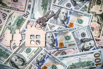 Symbol of home and family against the background of the American currency 