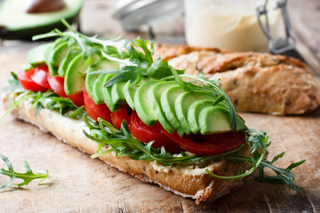 Vegan sandwich with avocado and tomatoes