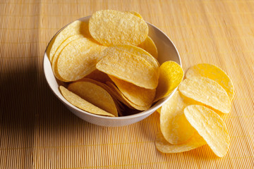 Potato chips in bowl on a table