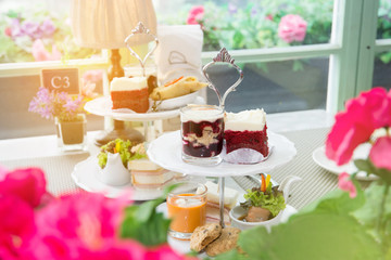 Delicious afternoon tea ceremony with snacks in restaurant.