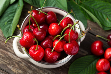 bowl with red cherries, freshly picked cherries. © luckybusiness